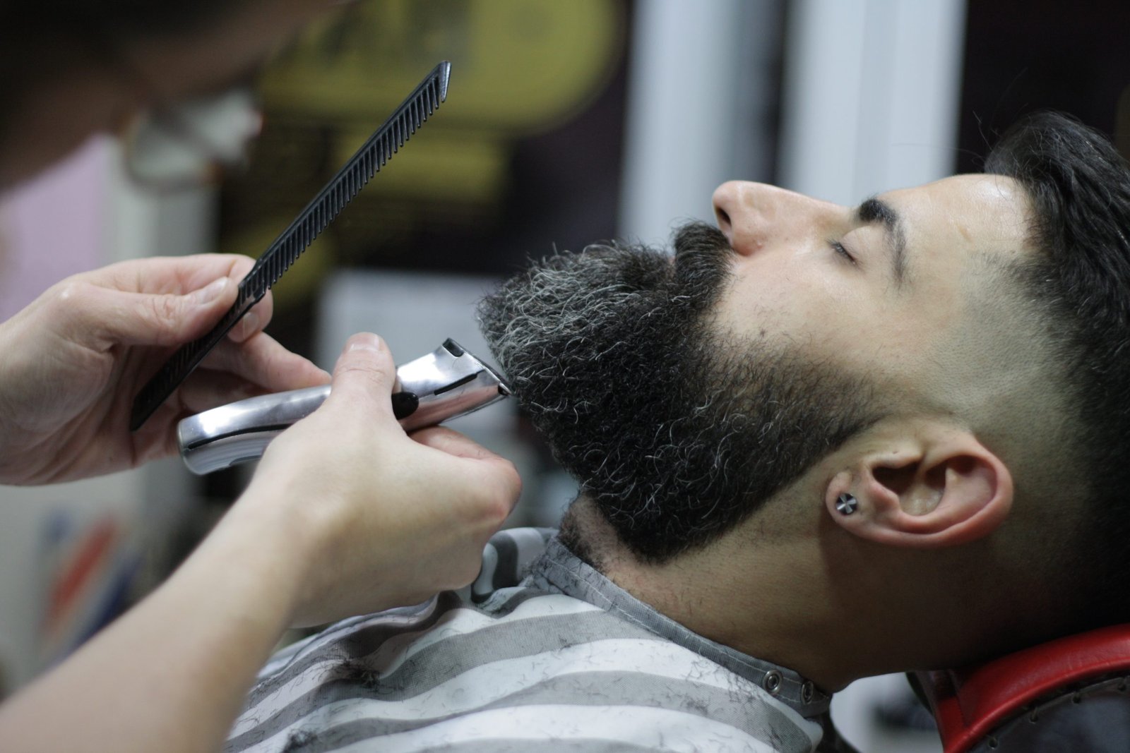 barber cutting a beard with machine clippers high-wycombe