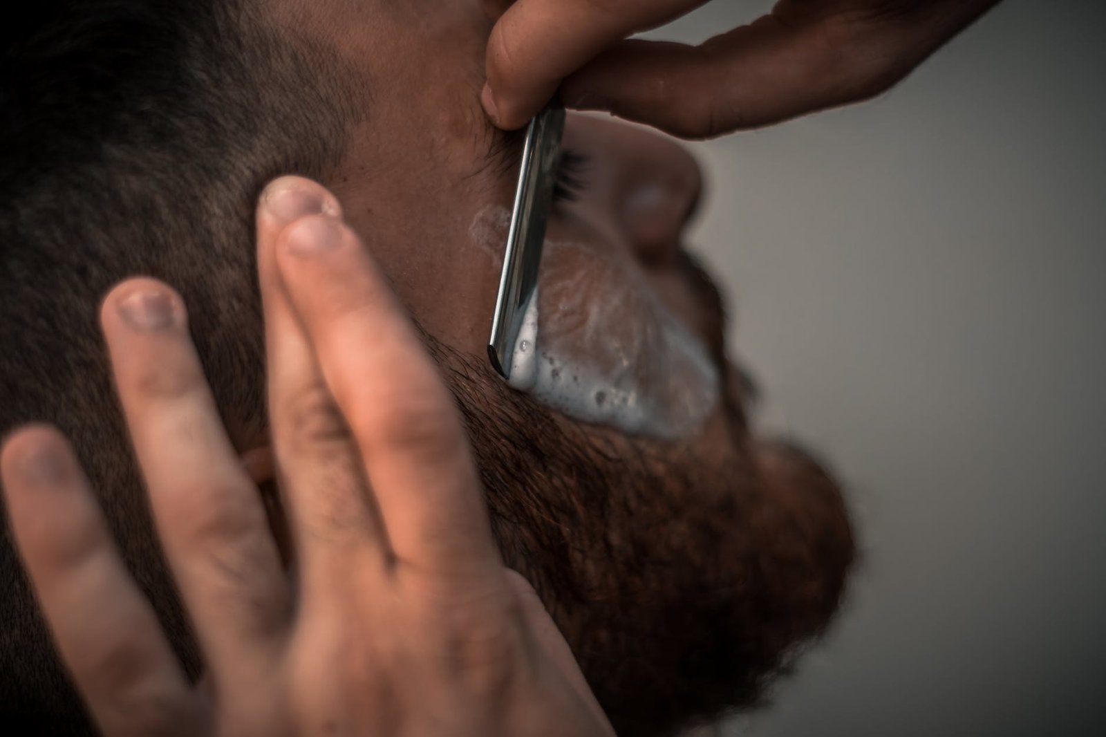 person getting a close razor shave high-wycombe